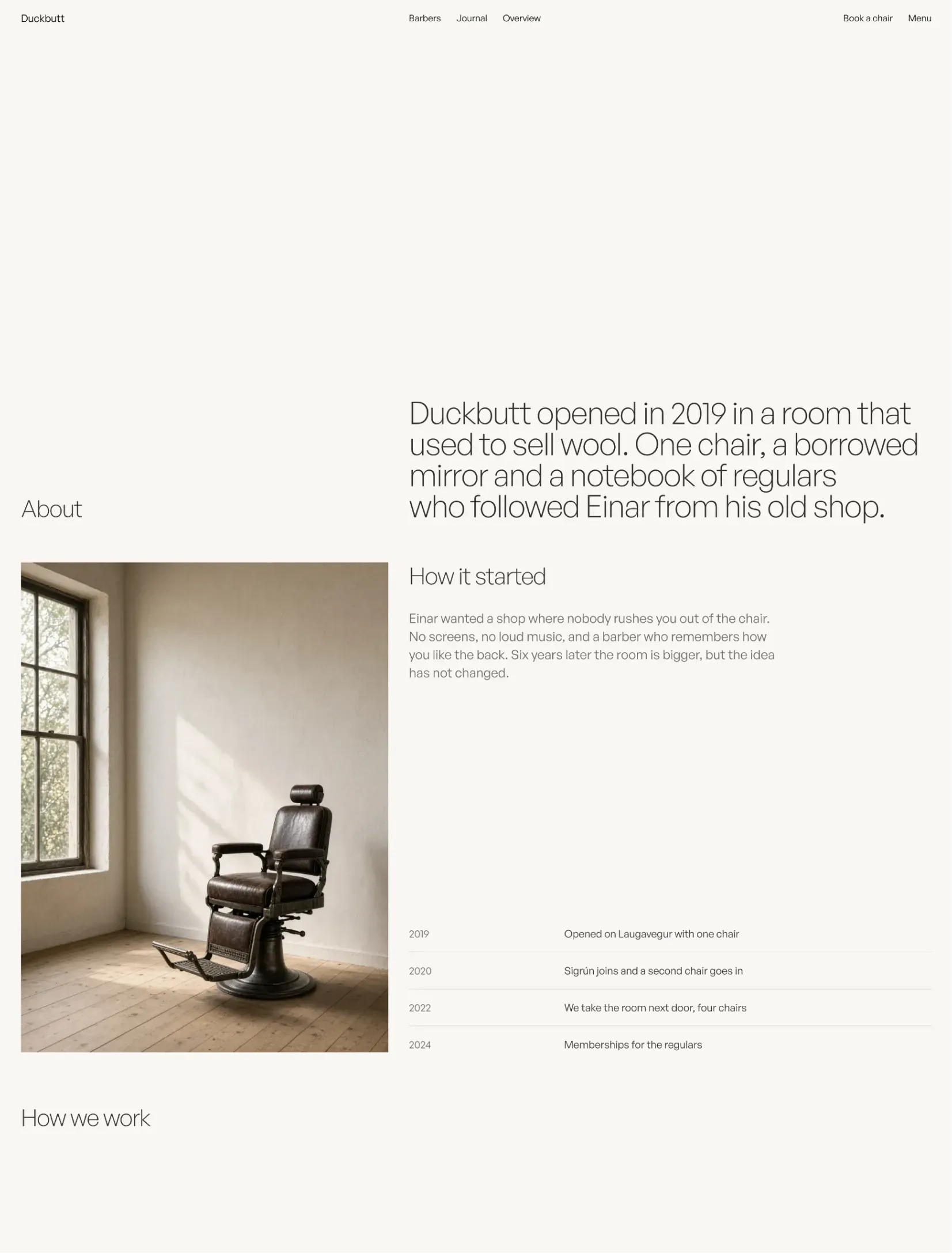 The Duckbutt about page with a single barber chair in an empty room